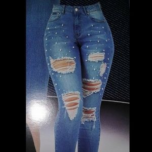 Ripped jeans with pearls. New